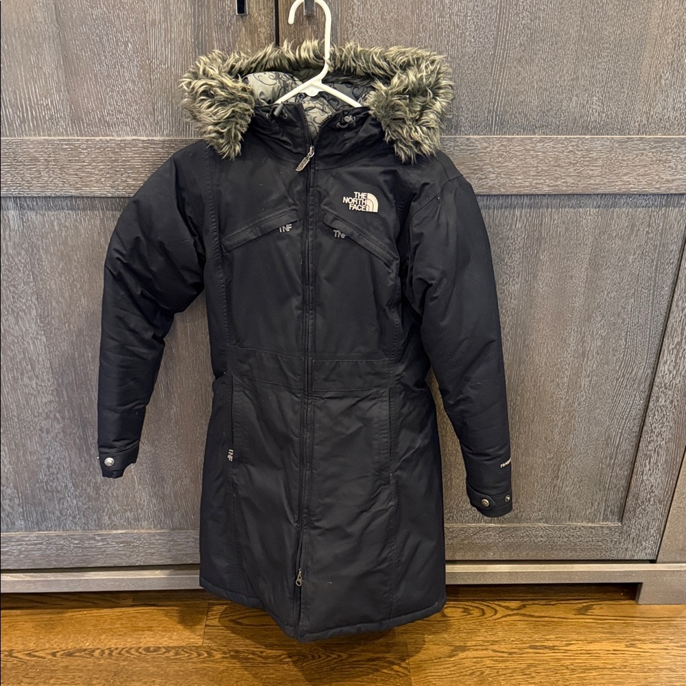 The North Face women’s Black Coat with Faux Fur Hood. Size XS. Very warm